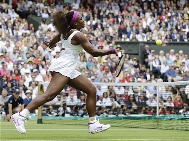Serena Williams of the United States plays a shot against Agnieszka Radwanska of Poland during the women's final match at the All England Lawn Tennis Championships at Wimbledon, England, Saturday, July 7, 2012. (AP Photo/Alastair Grant)