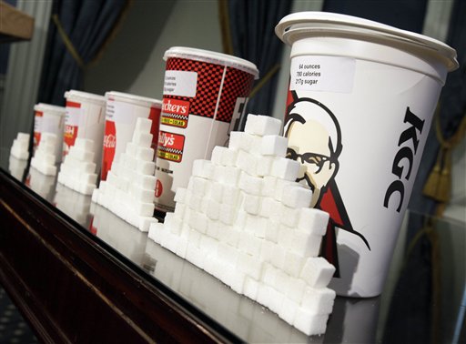 A display of various size cups and sugar cubes is displayed at a news conference at New York's City Hall. The city Board of Health is scheduled to hold a hearing today on the proposal to ban the sale of sugary drinks larger than 16 ounces at city restaurants, movie theaters and other eateries.