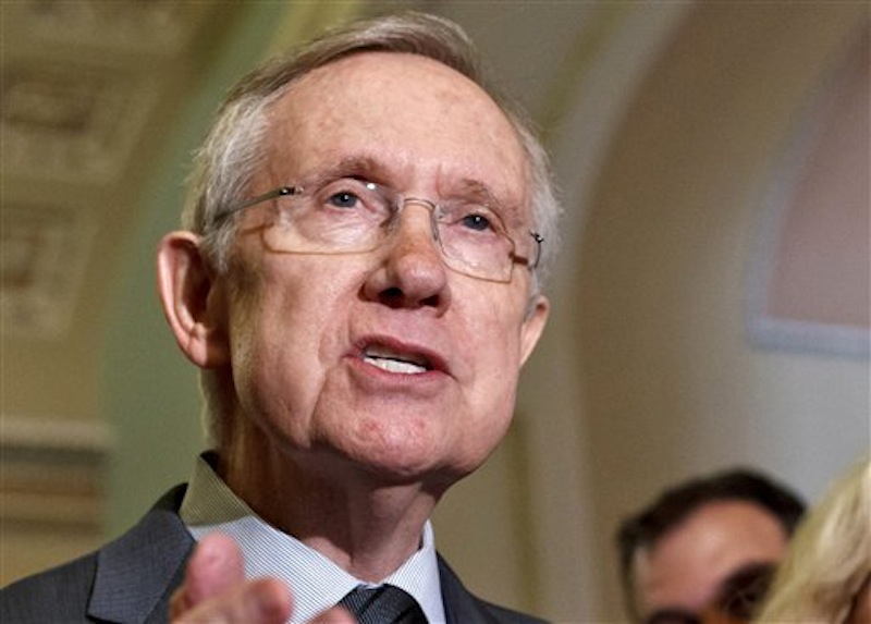 In this June 5, 2012 file photo, Senate Majority Leader Harry Reid, D-Nev. speaks on Capitol Hill in Washington. Uniforms for U.S. Olympic athletes are American red, white and blue _ but made in China. That has members of Congress fuming. Republicans and Democrats railed Thursday about the U.S. Olympic Committee's decision to dress the U.S. team in Chinese manufactured berets, blazers and pants while the American textile industry struggles economically with many U.S. workers desperate for jobs. (AP Photo/J. Scott Applewhite, File)
