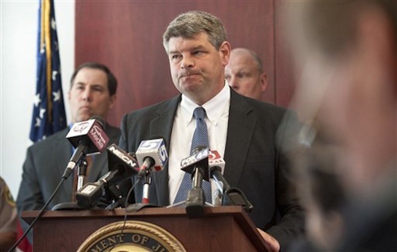 U.S. Attorney Tristan Coffin speaks at a news conference about a missing couple in Burlington, Vt., Friday, July 20, 2012. A Vermont couple missing for more than a year were abducted and murdered and a suspect is in custody in another state, federal authorities said Friday. "The person believed to have committed the murders is in custody in another state and will remain in custody," said Coffin. (AP Photo/Burlington Free Press, Glenn Russell)