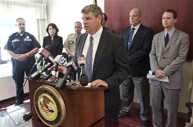U.S. Attorney Tristan Coffin speaks at a news conference about a missing couple in Burlington, Vt., Friday, July 20, 2012. A Vermont couple missing for more than a year were abducted and murdered and a suspect is in custody in another state, federal authorities said Friday. "The person believed to have committed the murders is in custody in another state and will remain in custody," said Coffin. (AP Photo/Burlington Free Press, Glenn Russell)