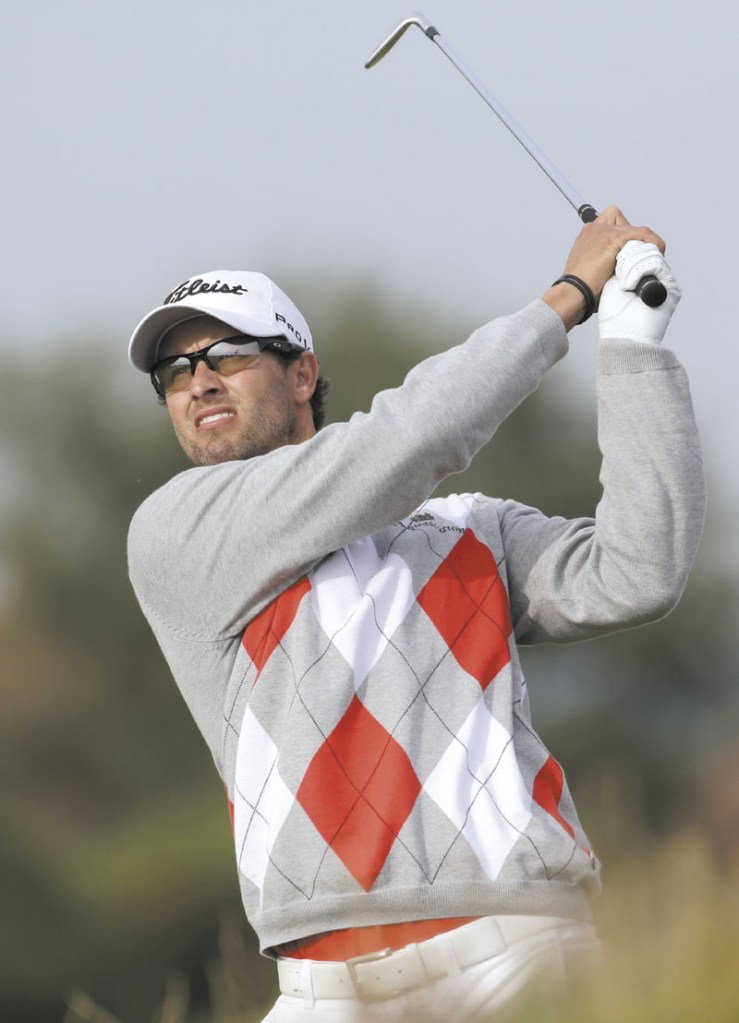 YOUR LEADER: Adam Scott plays a shot off the eighth tee Saturday at Royal Lytham & St Annes during the third round of the British Open Golf Championship. Scott has a four-shot lead headining into the final round.