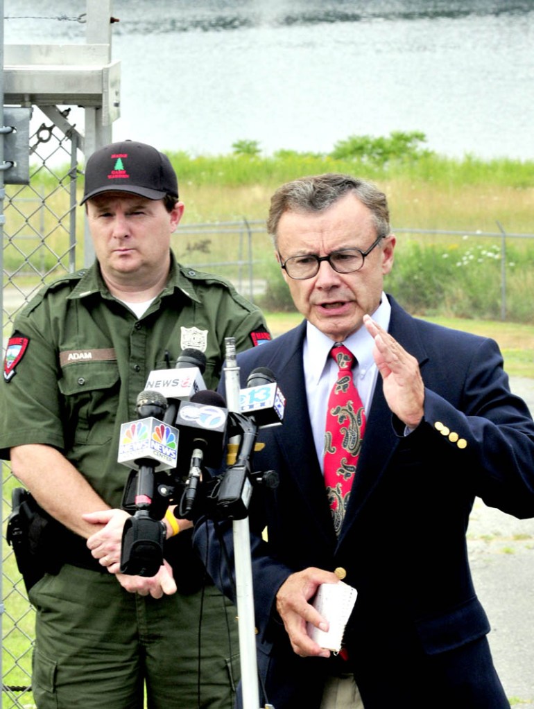 UPDATE: Department of Public Safety Spokesman Steve McCausland, right, gives an update on the extensive search for Ayla Reynolds along the Kennebec River, background, done on Tuesday by several agencies. At left is Lt. Kevin Adam of the Maine Warden Service.