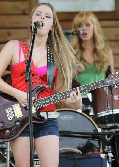 A SISTER ACT: The Veayo Twins perform at the 2nd annual Battle of the Bands at Fort Halifax Park in Winslow on Sunday. Kristen, front, and her 16-year-old twin sister Katherine, on drums, will be juniors this fall at Hall-Dale High School.