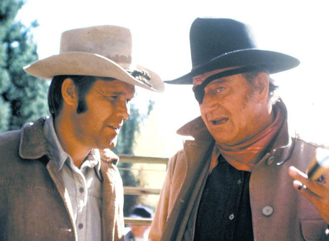 Glen Campbell, left, in a scene from the movie "True Grit" with John Wayne.