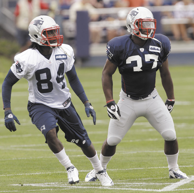 Back to work: Deion Branch (84) runs a route during the first day of training camp Thursday in Foxborough, Mass. Branch signed a one-year deal to remain in New England this offseason.