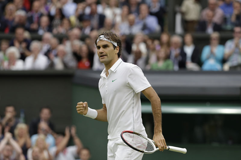 REASON TO CELEBRATE: Roger Federer celebrates during his match against Novak Djokovic on Friday at the All England Lawn Tennis Championships at Wimbledon, England. Federer beat Djokovic6-3, 3-6, 6-4, 6-3 to advance to his eighth Wimbledon final.