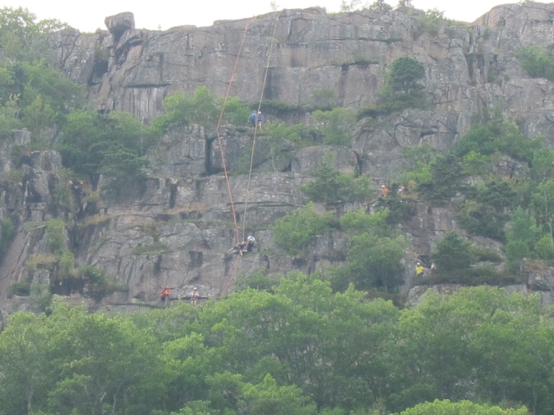 Ropes are visible as rescuers attend Shirley Ladd, a New Hampshire woman who fell 60 feet while hiking a difficult trail in Acadia National Park on Saturday.