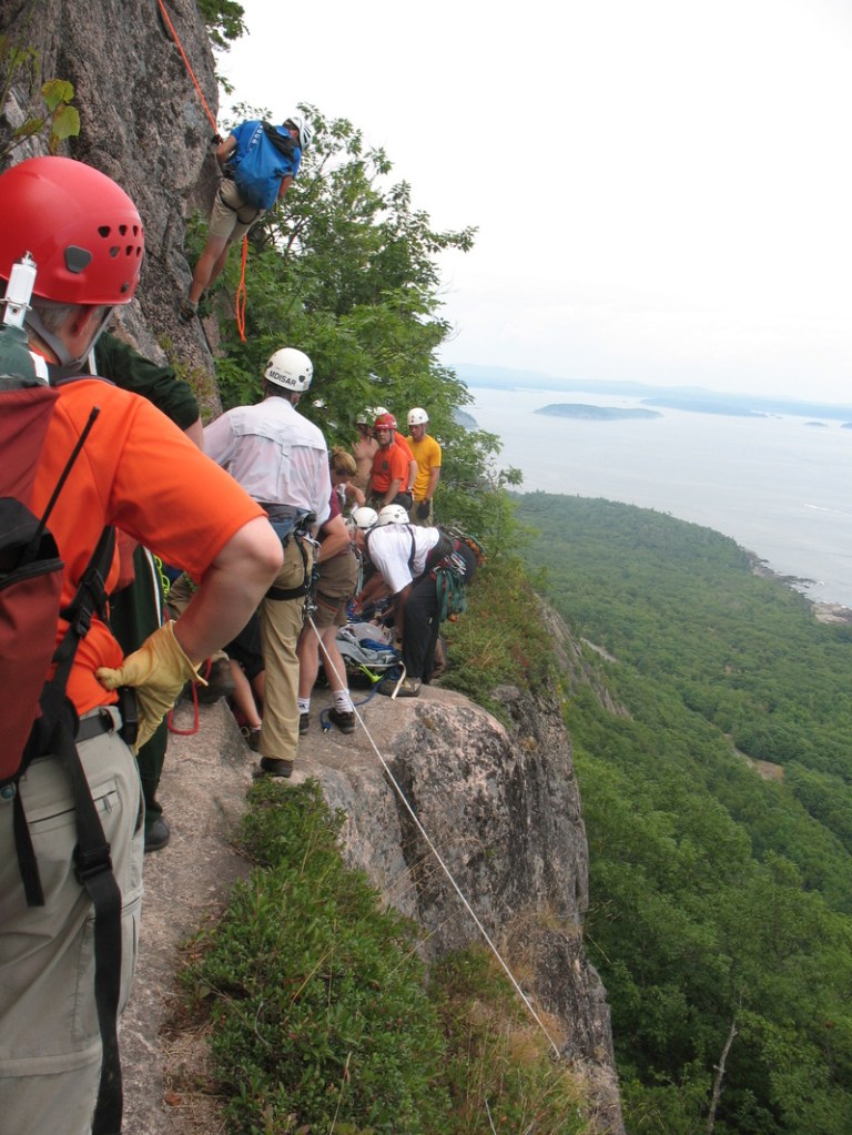 Rescuers use climbing equipment to haul an injured hiker 250 feet up Champlain Mountain in Acadia National Park on Saturday. Shirley Ladd, a student at UMaine, later died of her injuries. She was remembered for her outgoing personality.