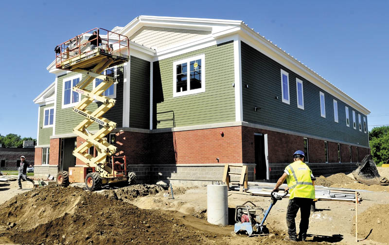 NEW HOME: Workers continue building the new Mid-Maine Homeless Shelter off Colby Street in Waterville last week.