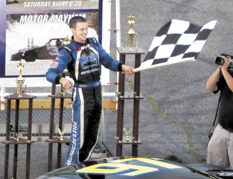 REASON TO CELEBRATE: Joey Polewarczyk, Jr. celebrates after winning the TD Bank 250 on Sunday at Oxford Plains Speedway in Oxford.