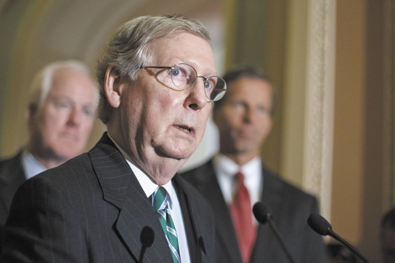 On Monday, Senate Minority Leader Mitch McConnell, of Ky., center, said the odds are against repealing the health care law championed by President Barack Obama. McConnell is seen here last week with Sen. John Cornyn, R-Texas, left, and Sen. John Thune, R-S.D.
