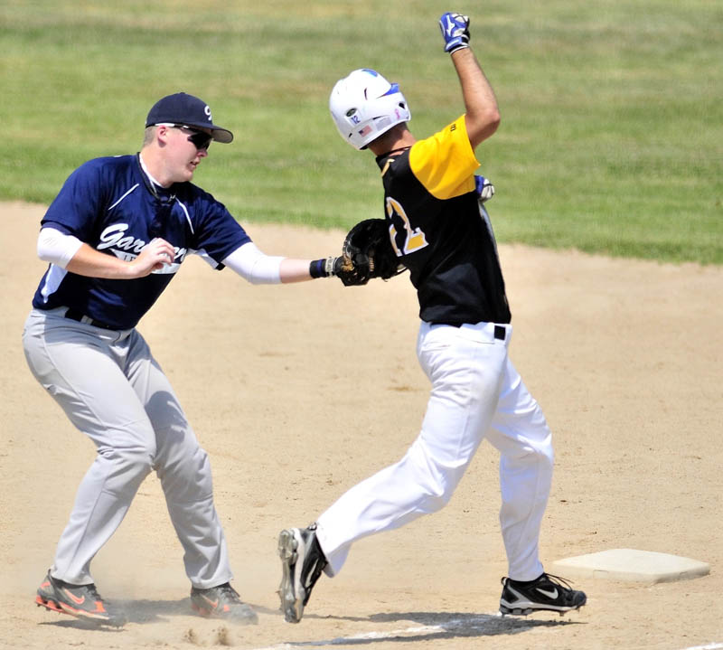 Gardiner first baseman Spencer Allen, left, tags out South China hitter Shyler Scates during the American Legion baseball tourney on Saturday in Augusta.