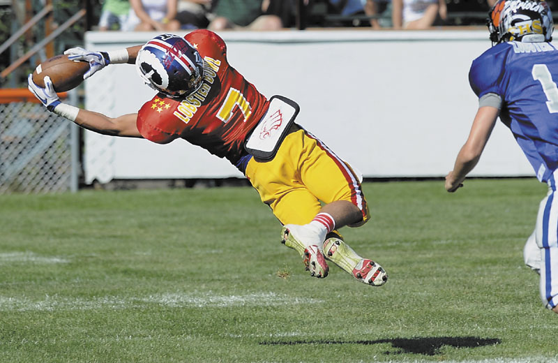 DIVING GRAB: Sam Dexter of Messalonskee makes a diving catch in first half of the Maine Shrine Lobster Bowl on Saturday at Waterhouse Field in Biddeford. Dexter caught eight passes for 87 yards and a touchdown in the East’s 48-24 loss.