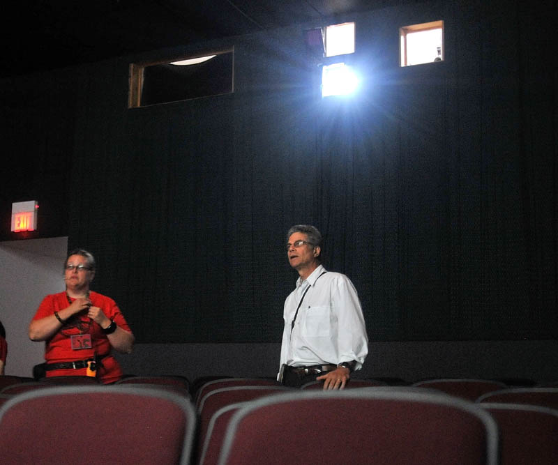 HERE WE GO: Director Richard Kane, right, goes through a sound and visual check with Serena Sanborn at Railroad Square Cinema in Waterville on Friday.