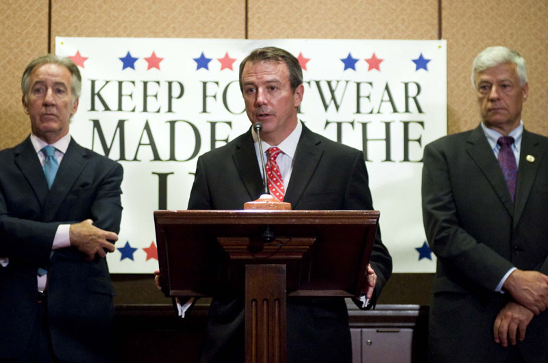MADE IN AMERICA: In this photograph taken by AP Images for New Balance Athletic Shoe Inc., Robert DeMartini, president and CEO of New Balance, leads a news conference on Wednesday in Washington with Rep. Richard Neal, D-Mass., left, and Rep. Michael Michaud, D-2nd District. DeMartini and workers from the New Balance factories in New England were on Capitol Hill to press their case for saving American jobs by stopping the elimination of the tariff on imported shoes under discussion in the Trans-Pacific Partnership negotiations.