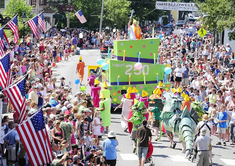 Dancing candles and dragons following a giant birthday cake for the city’s 250th birthday was this year’s entry from the No Ha neighborhood group in the Old Hallowell Day parade along Water Street on Saturday morning.