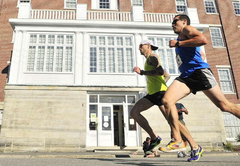 Seth Hasty, left, and Joe Viselli were neck and neck as they headed south on Second Street about half way through the Old Hallowell Day 5K on Saturday morning in Hallowell. Hasty pulled ahead for the win with a time of 17 minutes,17 seconds. Viselli finished second with a time of 17:35.