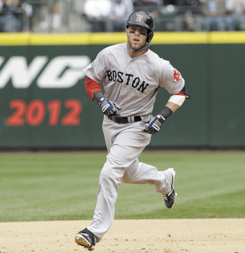 BIG BLAST: Boston’s Dustin Pedroia rounds the bases after hitting a solo home run to tie the game at 1 against Seattle on Sunday in Seattle. The Red Sox went on to beat the Mariners 2-1 in 10 innings.