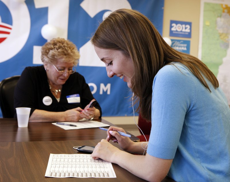 Anita McIntyre, left, and Angela Grills call voters at an Obama campaign office in Lakewood, Colo. Both candidates see women voters as key to winning the state.