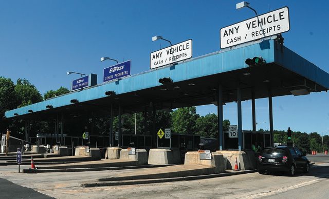Vehicles go through the Mile 101 toll plaza on the Maine Turnpike (Interstate 95) on Friday in West Gardiner.