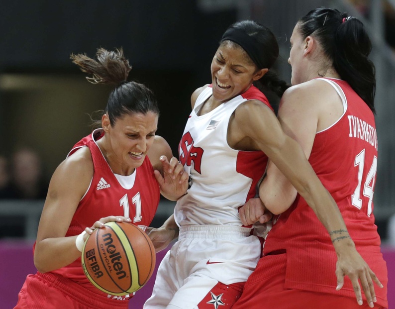United States forward Candace Parker gets squeezed away from Croatia guard Ana Lelas by her teammate Luca Ivankovic during Saturday's game at 2012 Summer Olympics in London. The U.S. won, 81-56.