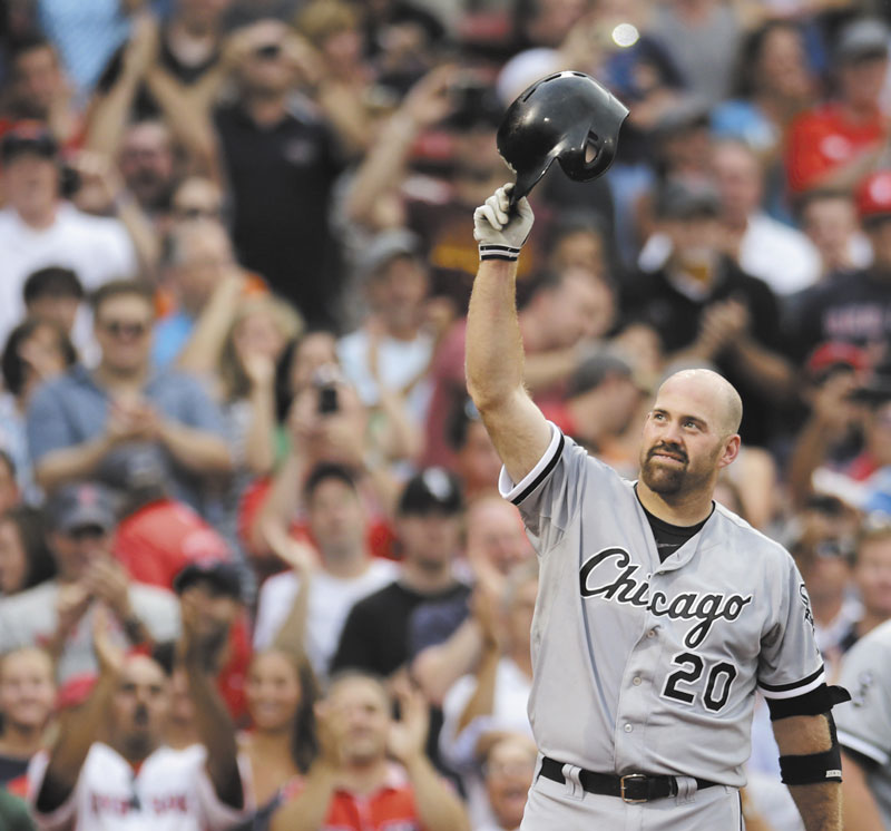 THANK YOU: Chicago White Sox third baseman Kevin Youkilis tips his batting helmet to fans as he receives a standing ovation during the first inning Monday at Fenway Park in Boston. Youkilis returned to Fenway, where he was a member of the 2004 and 2007 World Series Champion teams, for the first time since being traded.