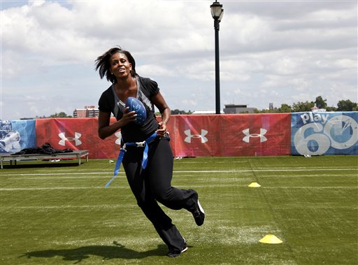 First lady Michelle Obama turns and runs after catching a pass while participating in the Let's Move! Campaign and the NFL's Play 60 Campaign festivities with area youth in New Orleans in this Sept. 8, 2010, photo.