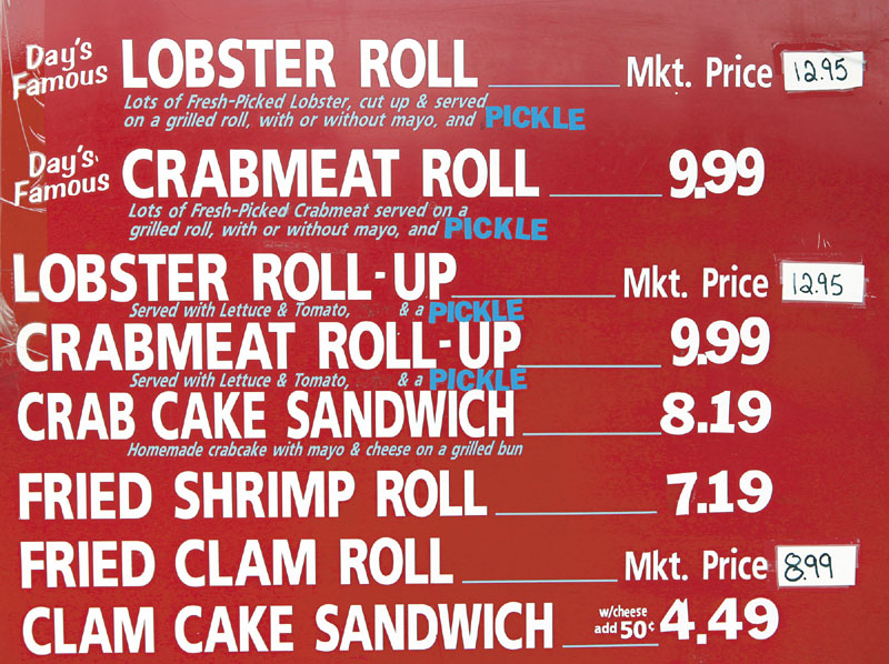 Prices on the menu board at Day's Take-Out in Yarmouth on Thursday.