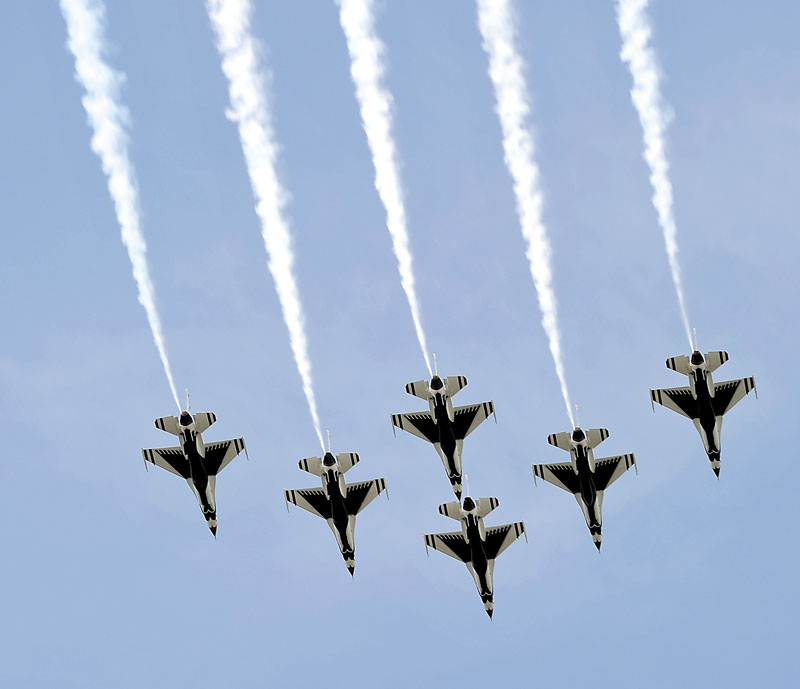 Five of the six United States Air Force Thunderbirds fly over local businesses on Thursday in a dress rehearsal of their part in the The Great State of Maine Air Show at the Brunswick Executive Airport.