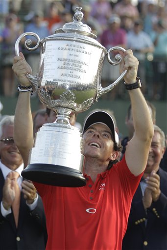 Rory McIlroy of Northern Ireland holds up the championship trophy after the final round of the PGA Championship golf tournament on the Ocean Course of the Kiawah Island Golf Resort in Kiawah Island, S.C., Sunday, Aug. 12, 2012. (AP Photo/Chuck Burton)