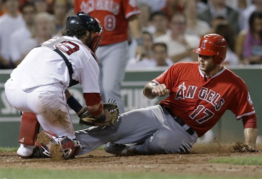 Los Angeles Angels' Chris Iannetta (17) is tagged out by Boston Red Sox catcher Jarrod Saltalamacchia as he tries to score on an infield grounder by Vernon Wells in the fifth inning of a baseball game at Fenway Park in Boston on Wednesday.