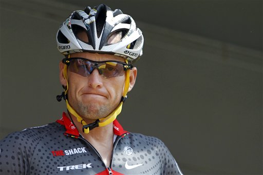 FILE - In this July 6, 2010, file photo, Lance Armstrong grimaces prior to the start of the third stage of the Tour de France cycling race in Wanze, Belgium. Armstrong said on Thursday, Aug. 23, 2012, that he is finished fighting charges from the United States Anti-Doping Agency that he used performance-enhancing drugs during his unprecedented cycling career, a decision that could put his string of seven Tour de France titles in jeopardy. (AP Photo/Christophe Ena, File)