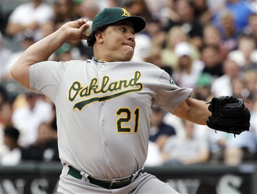 Oakland Athletics pitcher Bartolo Colon throws against the Chicago White Sox in this Aug. 12, 2012, photo