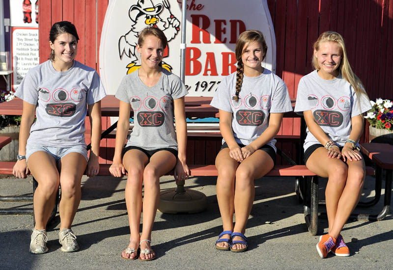 Staff Photo by Michael G. Seamans From left to right, Riley Jones, 18, Lauren Schassberger, 18, Audrey Jones, 16, and Molly Schassberger,17, pose for a portrait at the Red Barn in Winslow. The two sets of sisters will be running the Beach to Beacon.