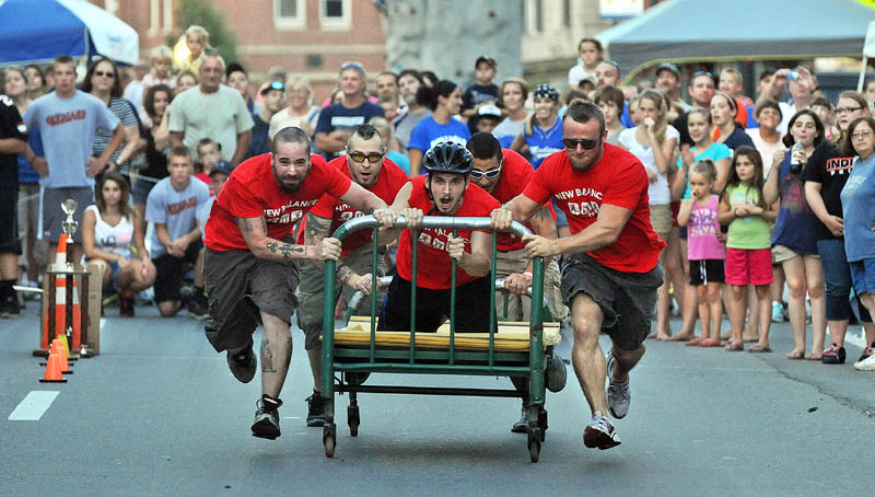 Staff photo by Michael G. Seamans Team N-Walk races in the Great Skowhegan Bed Races sponsored by the Parks and Recreation Department in downtown Skowhegan Thursday evening.