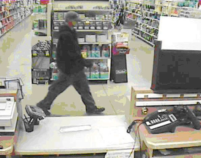 Store surveillance images of suspect in Osco pharmacy burglary.