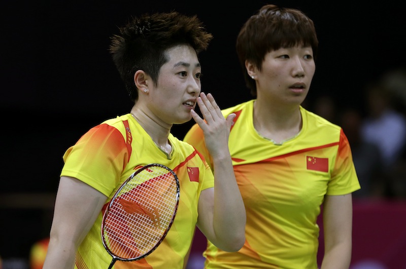 China's Yu Yang, left, and Wang Xiaoli talk while playing against Jung Kyun-eun and Kim Ha-na, of South Korea, in a women's doubles badminton match at the 2012 Summer Olympics, Tuesday, July 31, 2012, in London. World doubles champions Wang and Yu, and their South Korean opponents were booed loudly at the Olympics on Tuesday for appearing to try and lose their group match to earn an easier draw. (AP Photo/Andres Leighton) 2012 London Olympic Games;Summer Olympic games;Olympic games;Sports;Events;XXX Olympiad