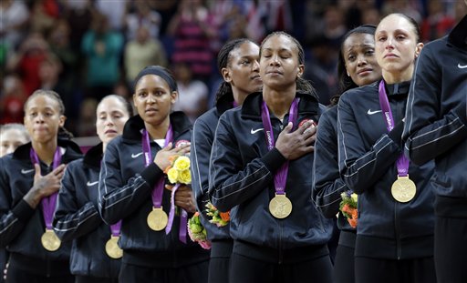 Members of the United States women's basketball team stand for the national anthem after receiving their gold medals following their win over France in the gold medal basketball game at the 2012 Summer Olympics, Saturday, Aug. 11, 2012, in London. (AP Photo/Eric Gay) 2012 London Olympic Games Summer Olympic games Olympic games Sports Events XXX Olympiad