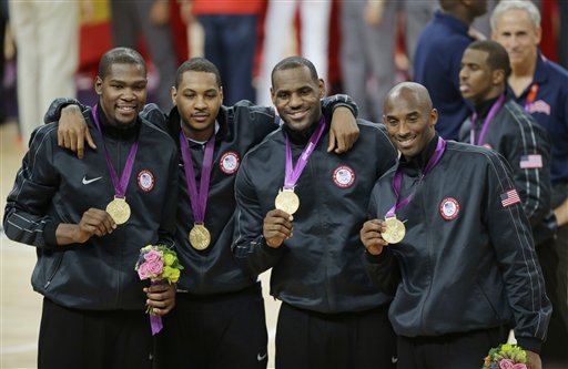 United States' Kevin Durant, Carmelo Anthony, LeBron James and Kobe Bryant, from left, display the gold medal following a ceremony at the 2012 Summer Olympics, Sunday, Aug. 12, 2012, in London. (AP Photo/Matt Slocum) 2012 London Olympic Games Summer Olympic games Olympic games Sports Events XXX Olympiad