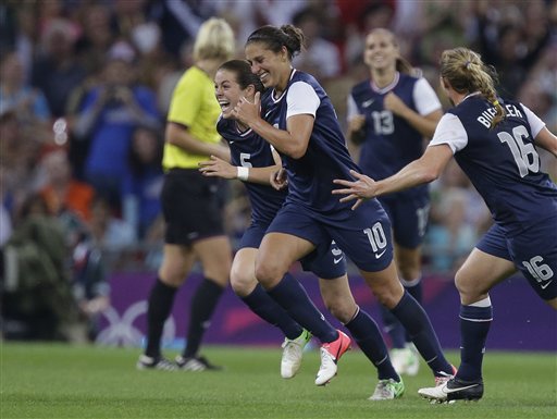United States' Carli Lloyd (10) celebrates her goal with teammates during the women's soccer gold medal match against Japan at the 2012 Summer Olympics, Thursday, Aug. 9, 2012, in London. (AP Photo/Julie Jacobson) 2012 London Olympic Games Summer Olympic games Olympic games Sports Events XXX Olympiad