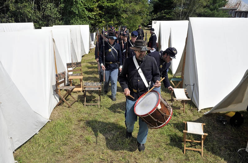 Staff photo by Michael G. Seamans The 20th Maine Regiment marches into their Civil-War era encapment during a Civil War re-enactment at Good Will-Hinkley in Fairfield Saturday. Events continue today and are open to the public from 9 a.m. to 2 p.m. A $5 donation is suggested.