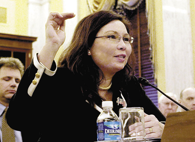 In this April 1, 2009 photo, then-Assistant Veterans Affairs Secretary-designate Tammy Duckworth testifies on Capitol Hill in Washington. After more than a decade of wars in Iraq and Afghanistan, dozens of military veterans — Republicans and Democrats — are running for Congress this election year as voters have shown a fresh enthusiasm for candidates with no elected experience. This year, as the military has opened more jobs to women closer to the front lines, several of those veterans are females with battlefield scars and pioneering accomplishments.