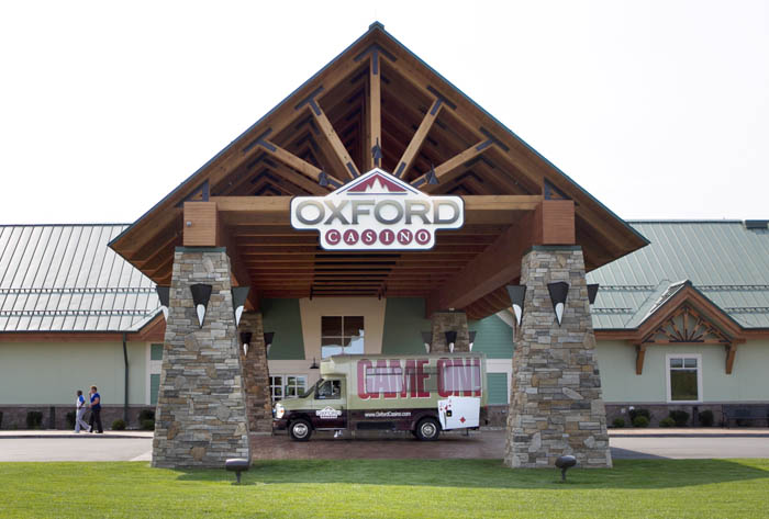 The Oxford Casino is planning to add 10 more table games and hundreds more slot machines in October, a spokesman says.