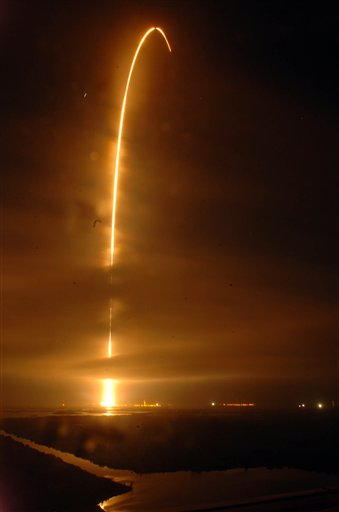 An Atlas V rocket lifts off from Cape Canaveral Air Force Station, Fla., Thursday morning in this long exposure photo. The rocket was carrying the twin Radiation Belt Storm Probes, designed to study space weather.