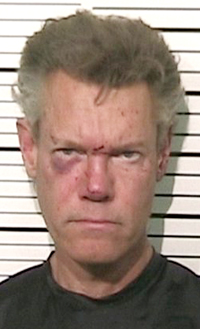 Randy Travis arrested naked, charged with DWI