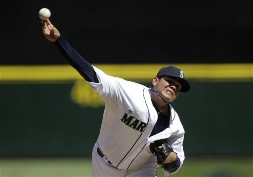 Seattle Mariners starting pitcher Felix Hernandez throws to a Tampa Bay Rays batter in the fourth inning of a baseball game, Wednesday, Aug. 15, 2012, in Seattle. (AP Photo/Ted S. Warren)