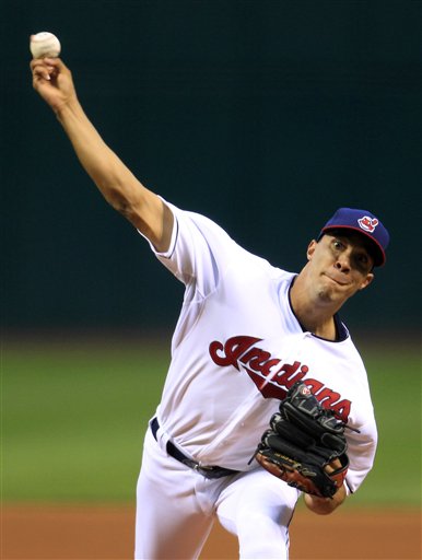 Cleveland Indians starting pitcher Ubaldo Jimenez delivers in the first inning of a baseball game against the Boston Red Sox, Thursday, Aug. 9, 2012, in Cleveland. (AP Photo/Tony Dejak)