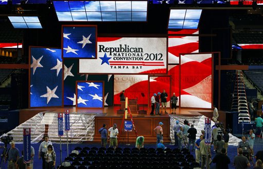 Workers prepare the stage for the Republican National Convention inside the Tampa Bay Times Forum in Tampa, Fla., on Saturday. GOP officials abruptly announced plans Saturday night to scrap the first day of their national convention, bowing to the threat of Tropical Storm Isaac.