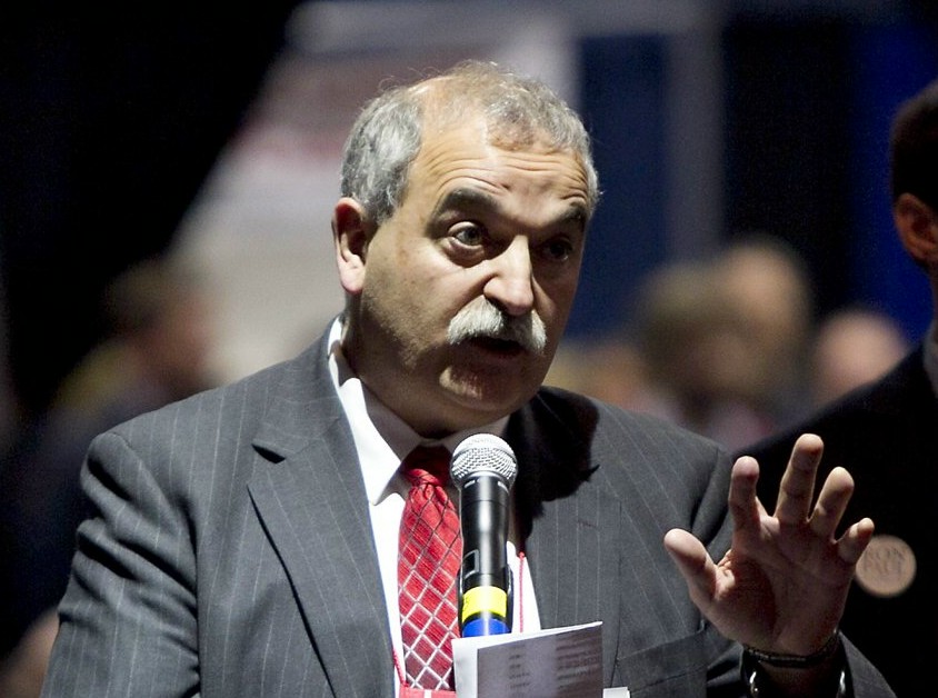 State party chairman Charlie Webster addresses the Republican Convention to urge leaders to try to wrap up business on time rather than incur additional costs for renting Augusta Civic Center in Augusta, Maine, Sunday, May 6, 2012. (AP Photo/Robert F. Bukaty)